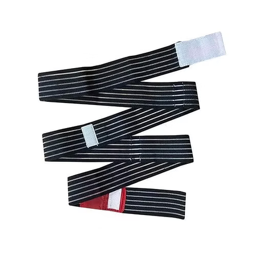 Black Slishman Pressure Wrap emergency trauma bandage laid out in a zigzag fashion with features visible