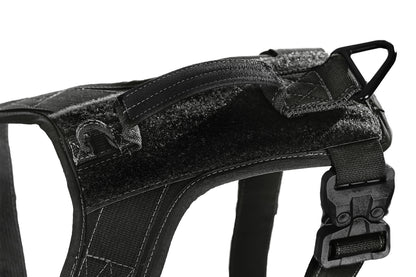 Black tactical dog harness on a white background